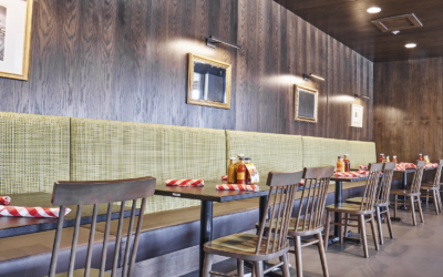 a table with chairs and a table with a lot of bottles on it