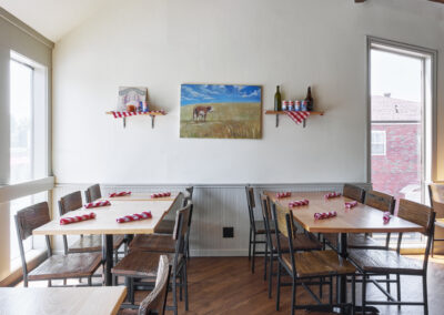 Cozy restaurant interior with wooden tables.