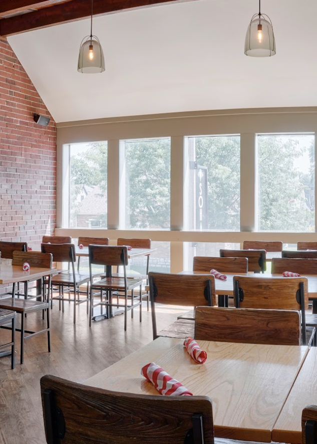 Empty restaurant with large windows.