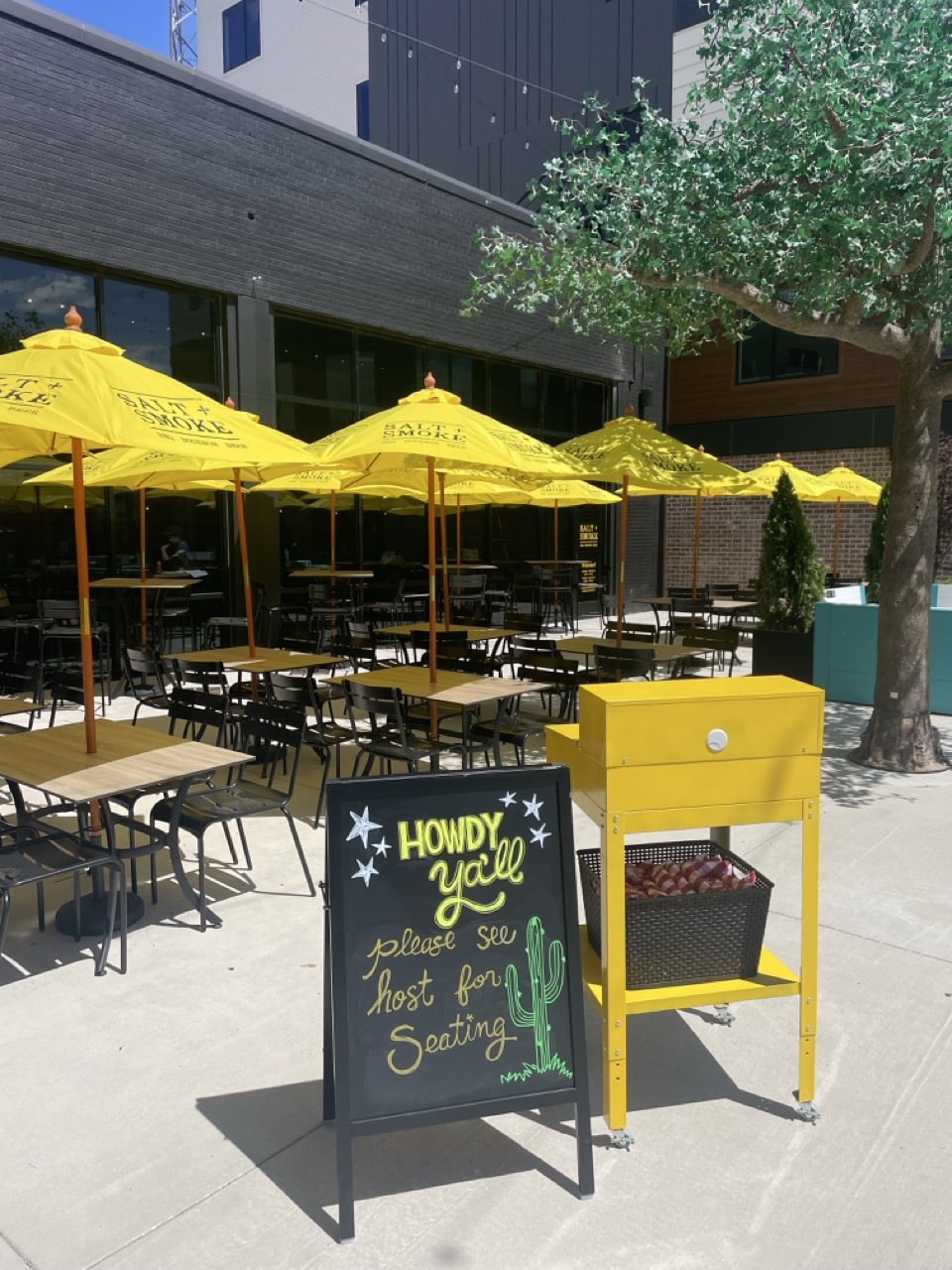 Outdoor dining area with yellow umbrellas