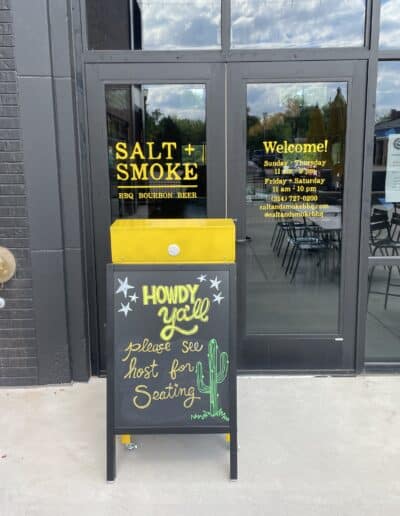 Restaurant entrance with welcoming sign