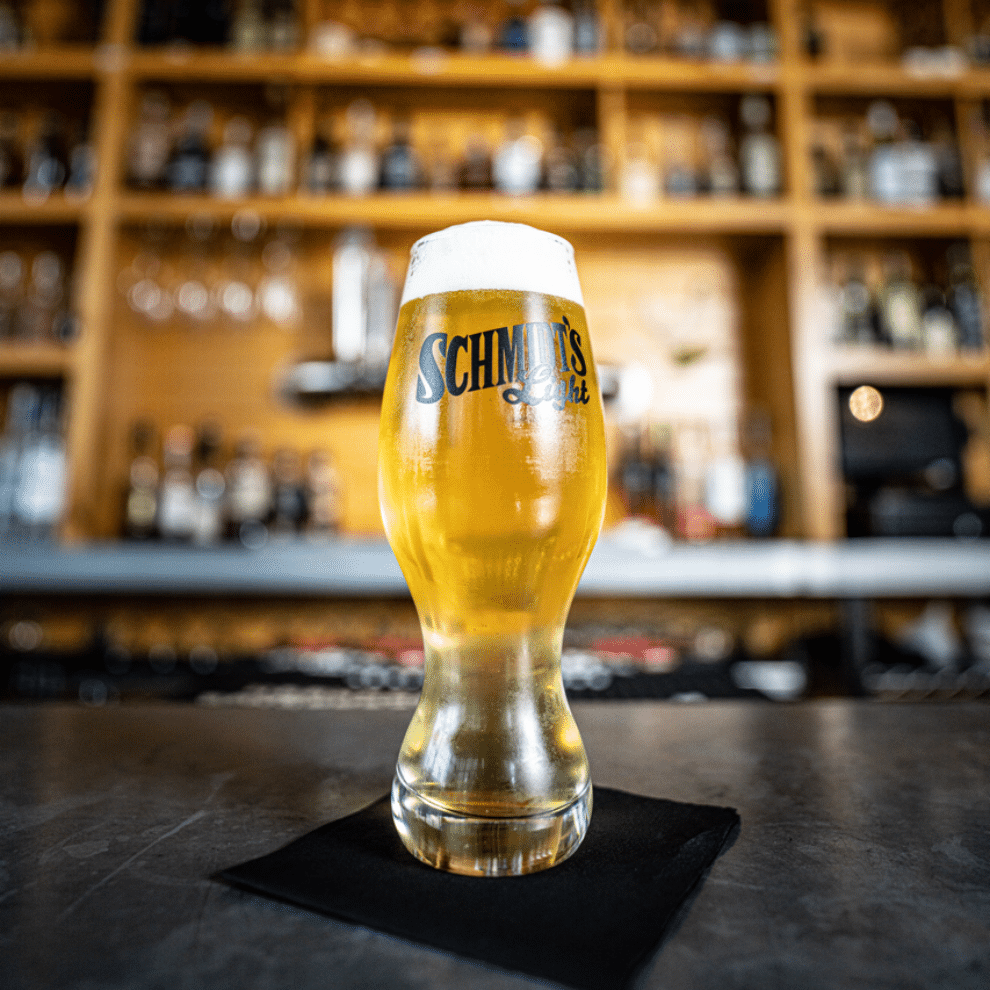 beer in the middle of a bar top table