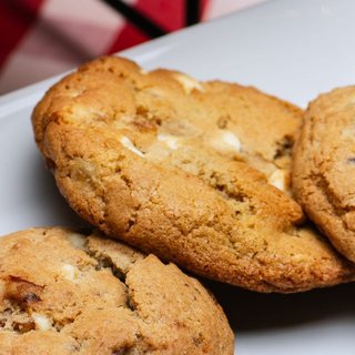 A cookie with apricot and white chocolate chips