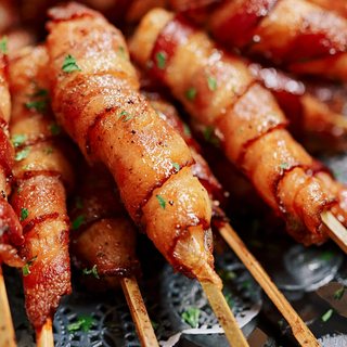 Bacon-wrapped shrimp on bamboo skewers