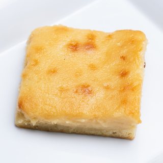 A square of golden gooey butter cake