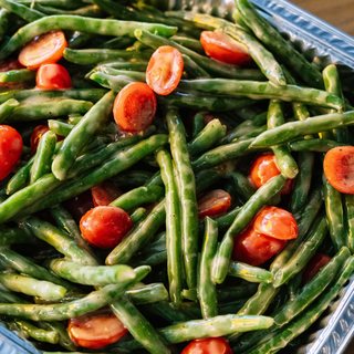 Green beans and cherry tomatoes tossed in dressing