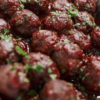 Glazed plant-based meatballs topped with parsley