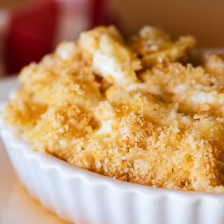 White cheddar mac and cheese with a cracker crumb topping