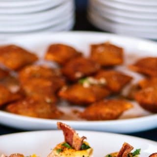 A plate of golden fried toasted ravioli