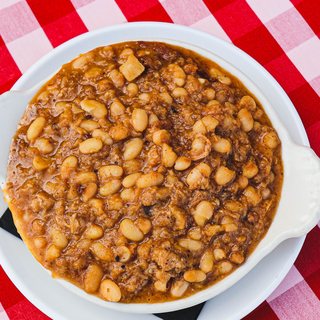 A bowl of pit beans with smoked bacon