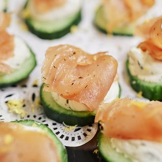 Salmon gravlax on cucumber rounds with herbed cream cheese