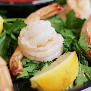 Chilled shrimp with cocktail sauce and lemon