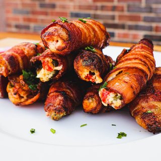 Bacon-wrapped jalapeños stuffed with cheese