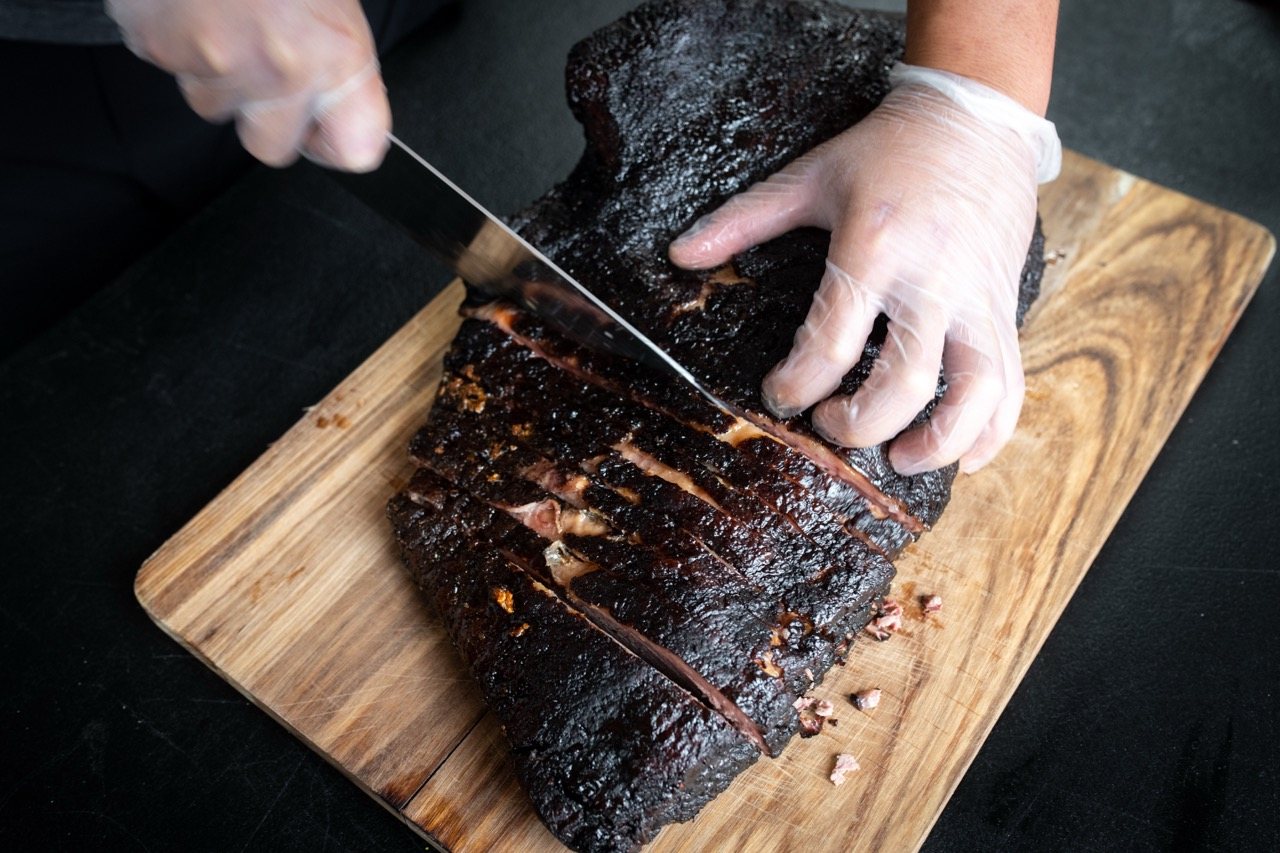 Jobs at Salt + Smoke 9 Our pitmaster slicing a whole smoked brisket