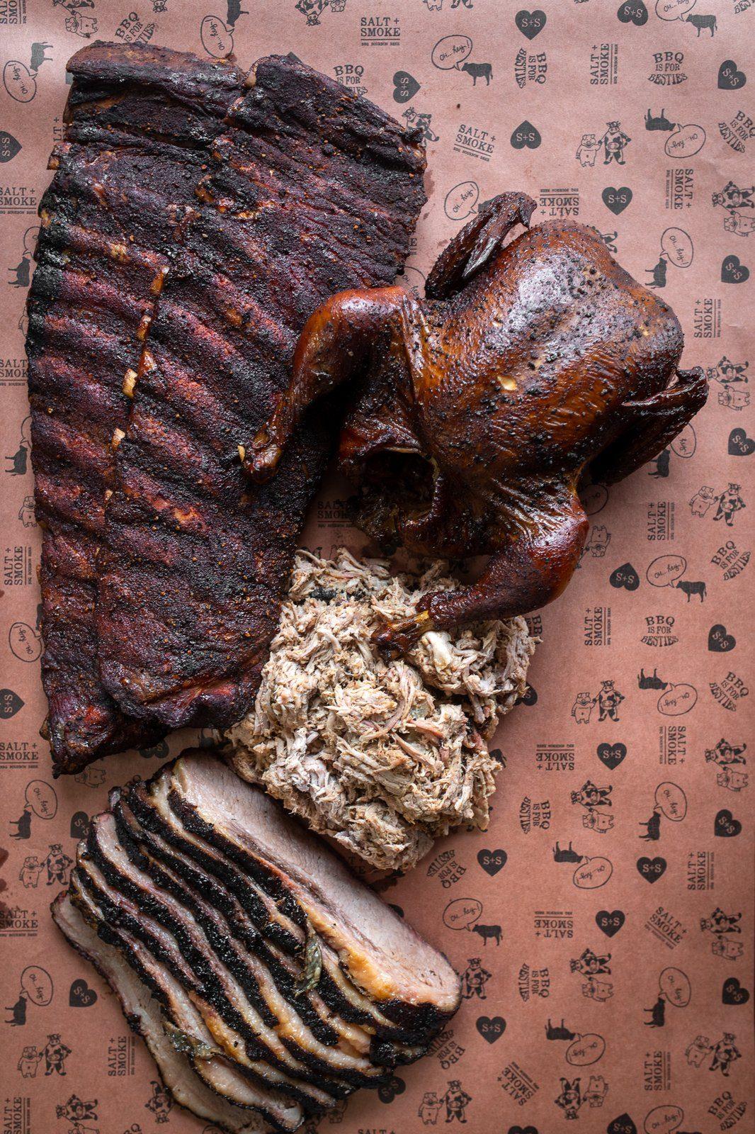 Corporate Gifting 4 A rack of ribs, a whole smoked chicken, pulled pork and sliced brisket on Salt + Smoke printed paper