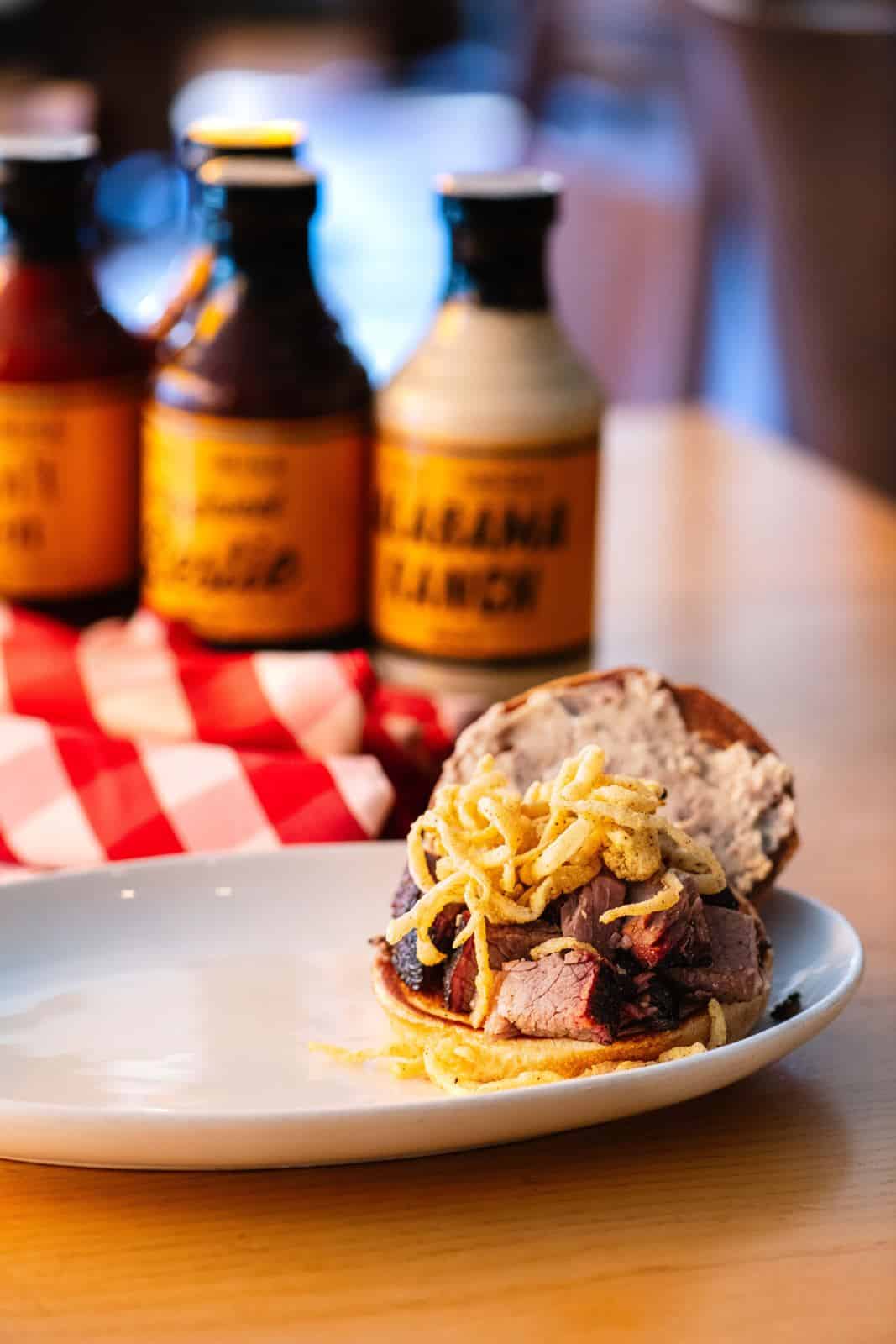 Edwardsville 12 A brisket sandwich with burnt end mayo and tobacco onions