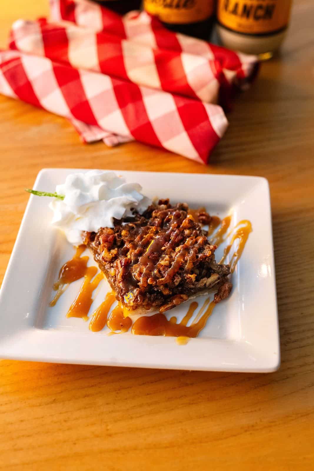 South County 11 A brown butter pecan bar with caramel and whipped cream