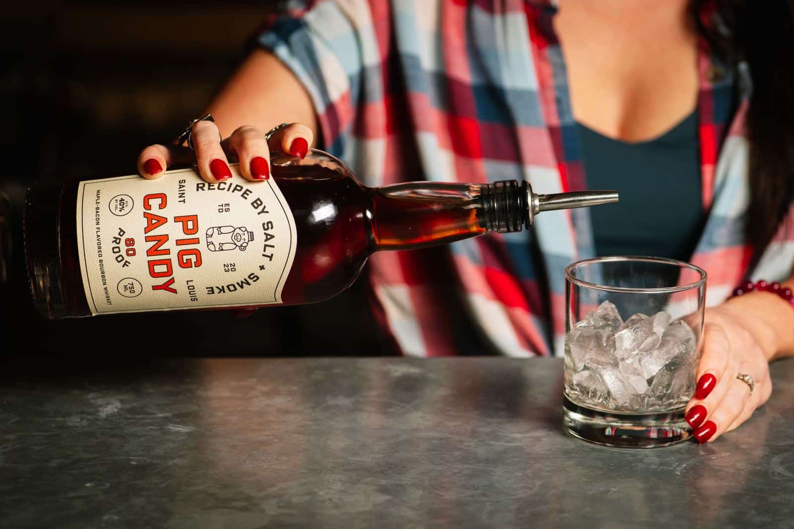FAQs 1 Pouring a Pig Candy bourbon over ice
